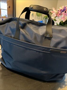 Tumi Navy Duffel Bag with Black Straps